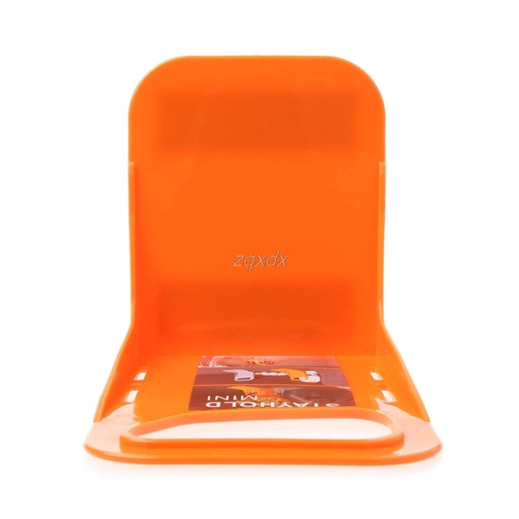 Orange plastic trunk partition base plate with raised ramp and center opening