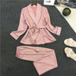 Silk-look pink pajama set with V-neck robe top, matching belt, and wide-leg pants