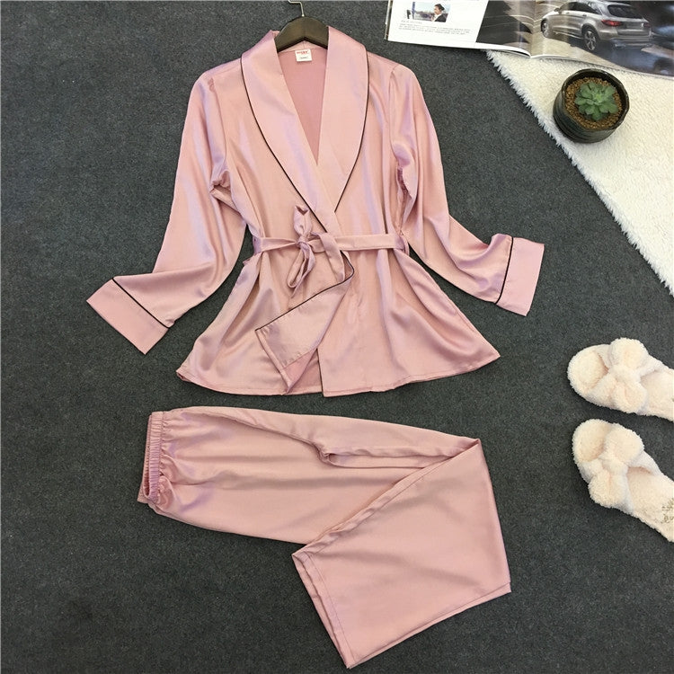 Silk-look pink pajama set with V-neck robe top, matching belt, and wide-leg pants