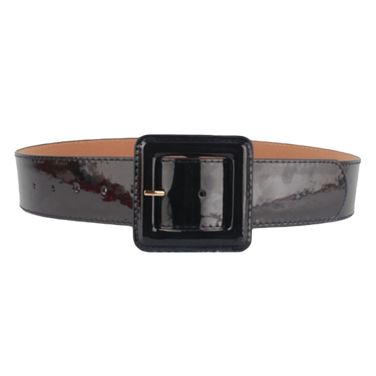 Glossy wide belt with square black buckle, centered front view