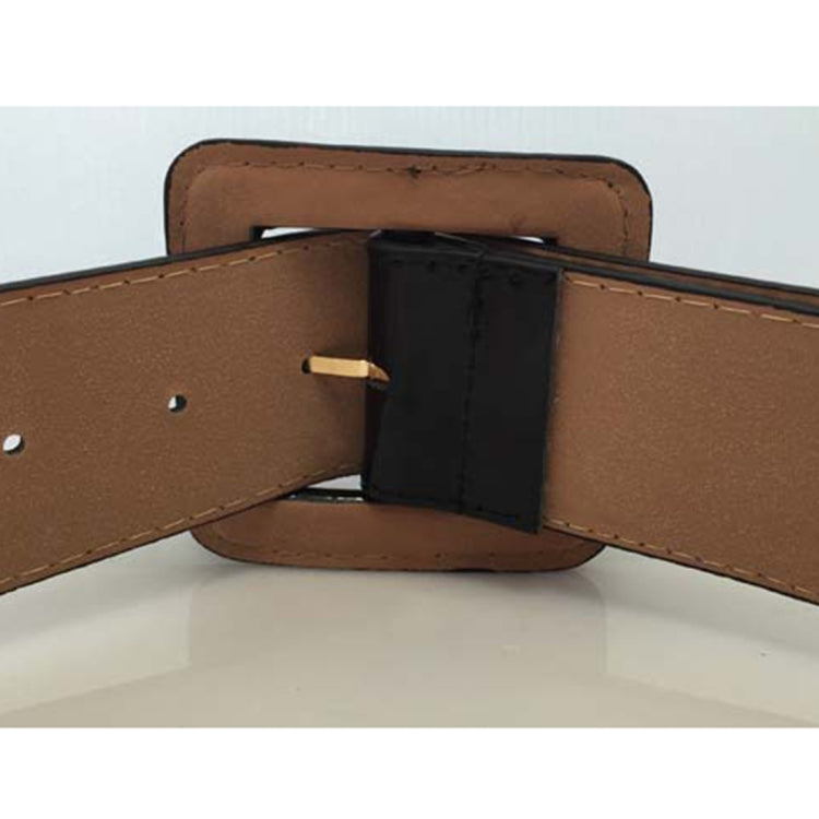 Wide belt with brown strap and square black buckle, inner side detail