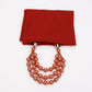 Red scarf with copper-gold imitation pearl necklace, layered round bead strands