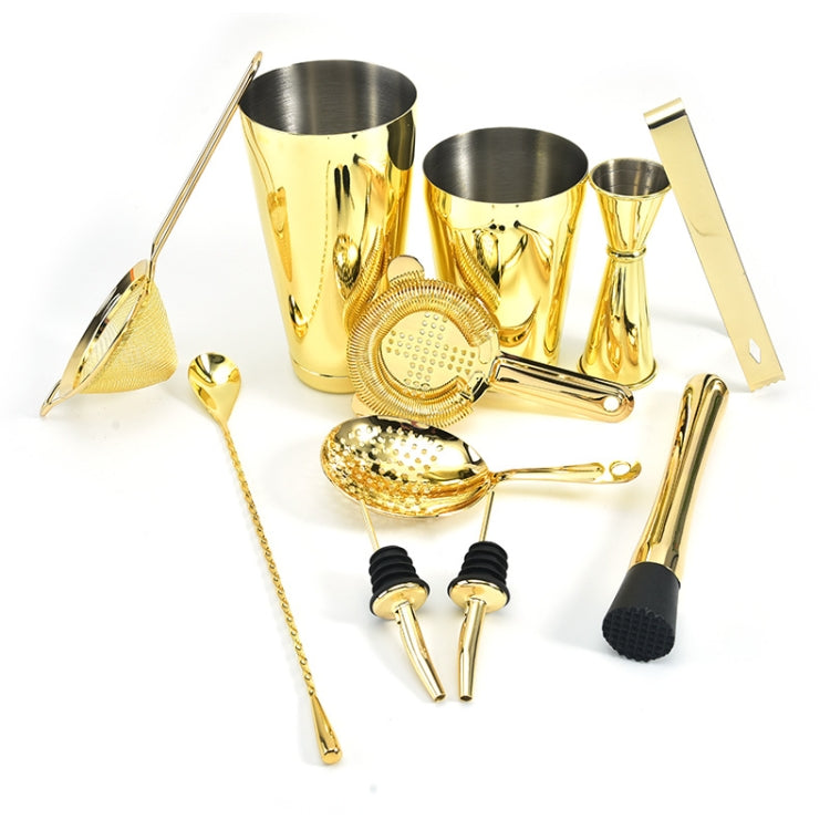 Gold cocktail mixing set with jigger, mesh strainer, spoon, pourer and mixing tools