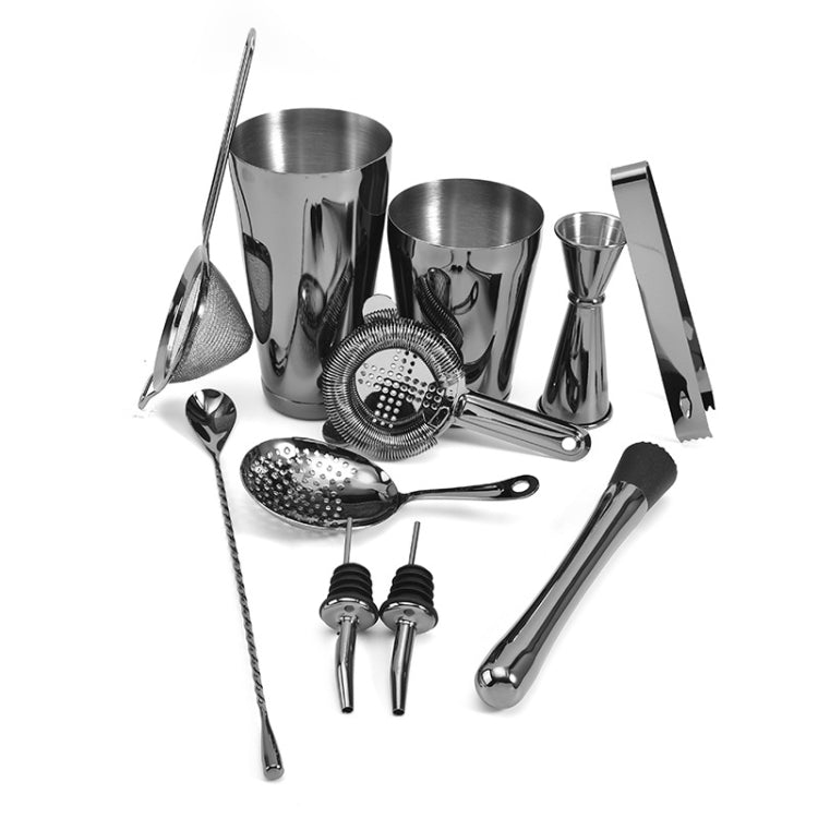 Silver cocktail mixing set with cups and mesh strainer disc, spoons and tongs