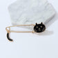 Black cat enamel pin brooch with curled tail, gold-toned pin and clasp