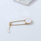 White cat enamel pin brooch with curled tail, gold-toned safety pin back