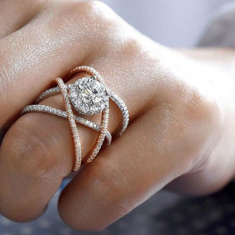Rose gold and silver-tone cross engagement ring with round zircon center stone