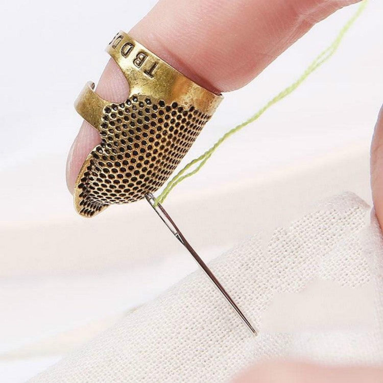 Adjustable metal sewing thimble with perforated gold-tone finger guard