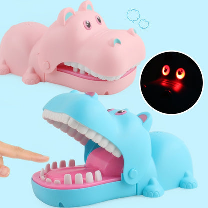 Cartoon hippo bite hand toy with open mouth, pink and blue shells, glowing red eyes