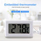White mini LCD indoor thermometer with Celsius screen and probe cable on table