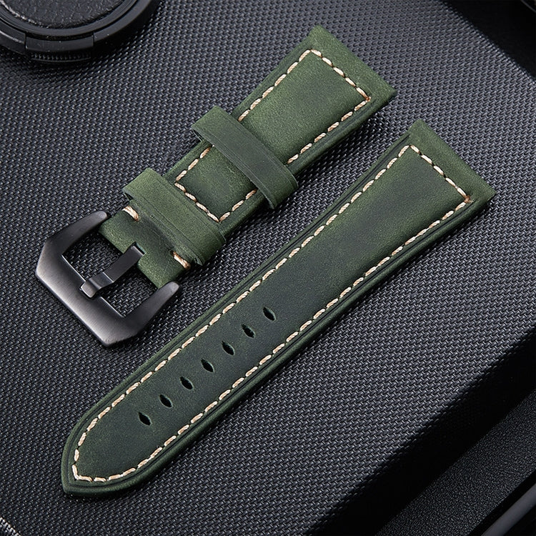 Olive green leather watch band with perforations, stitched border, and metal buckle.