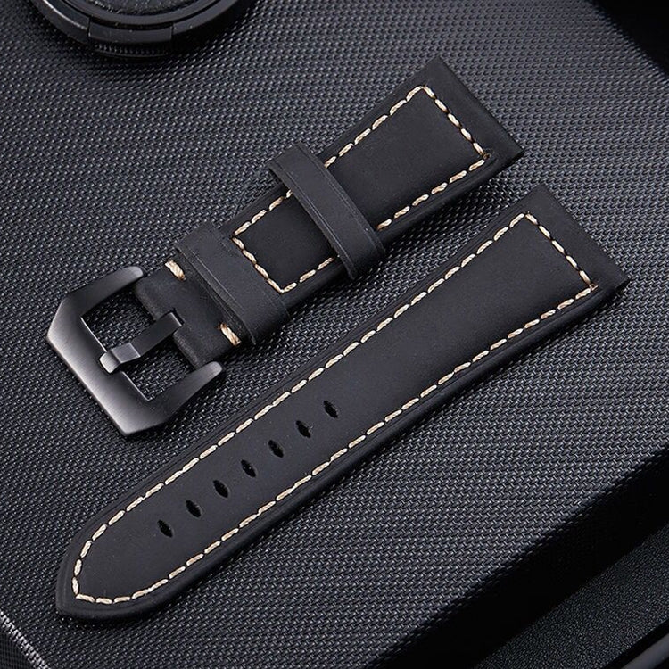 Black leather watch band with perforated holes, yellow stitching, and metal buckle.