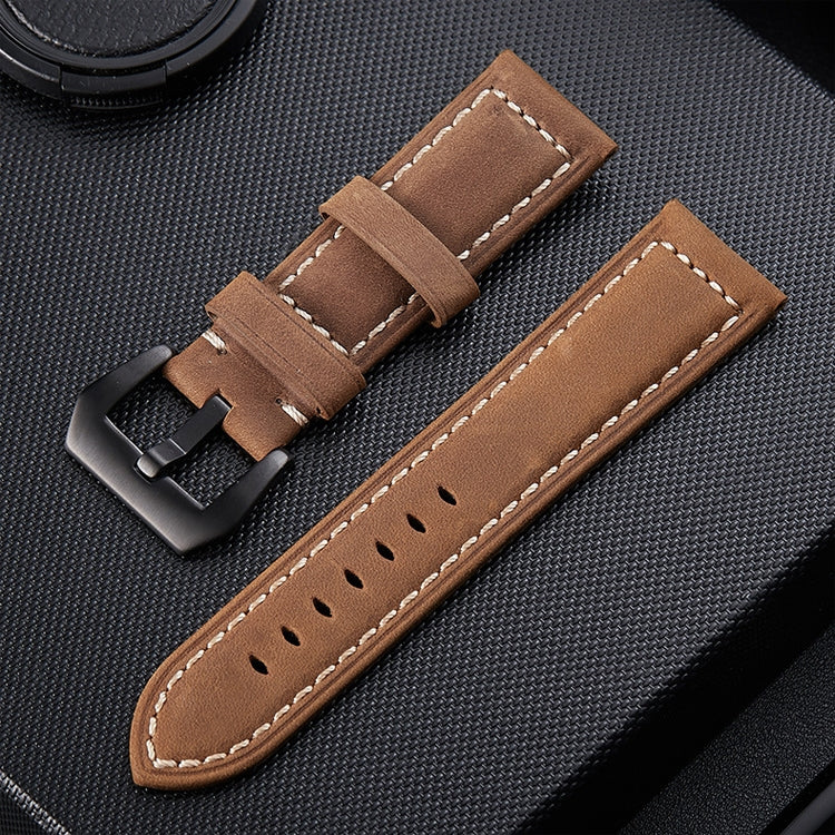 Light brown leather watch band with tan stitching, perforated holes, and metal buckle.