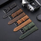 Leather watch strap display with multiple colors, each with buckle and perforated holes