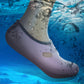 Dark gray water socks on foot with toe vent and perforated pattern