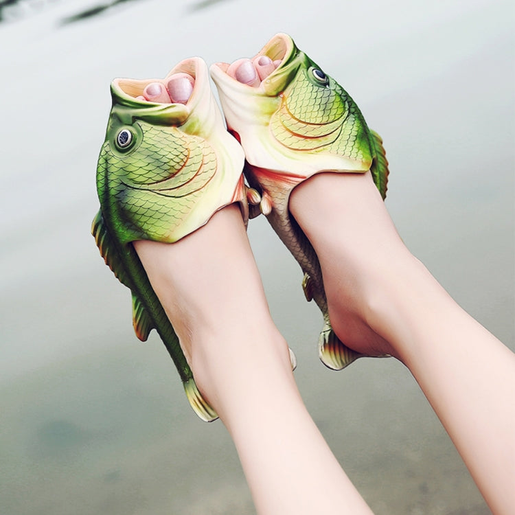 Pair of fish-themed EVA sandals on feet, green and white with open toe