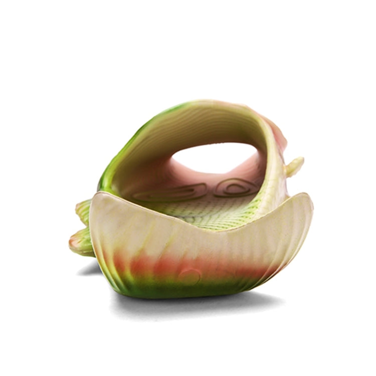Fish-shaped sandal heel opening with green and beige molded EVA texture