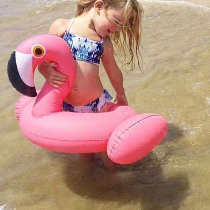 Pink flamingo-shaped inflatable pool float with two leg rings for kids
