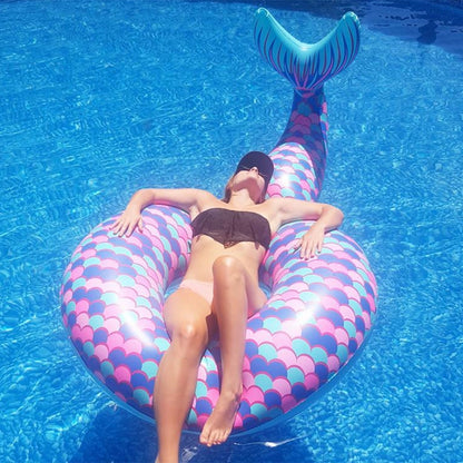 Inflatable mermaid tail lounge with purple-pink scale pattern and teal fin
