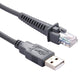 Close-up of USB-A to RJ45 cable ends, gray connectors and clear RJ45 plug