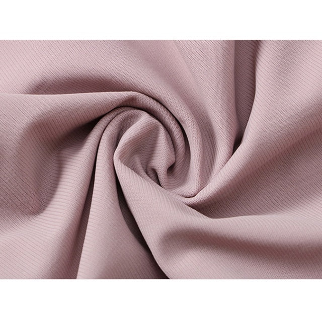 Women’s loose sports trousers, mauve pink, fabric and seams close-up