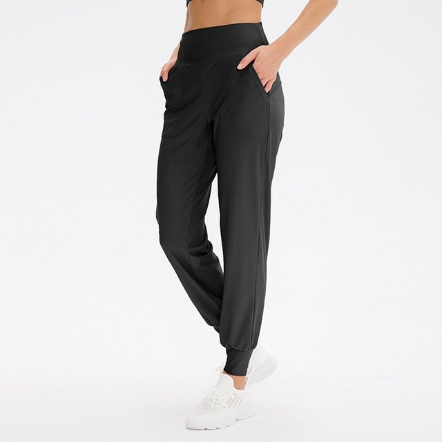 Women's loose sports trousers, black, elastic waistband with tapered jogger cuffs
