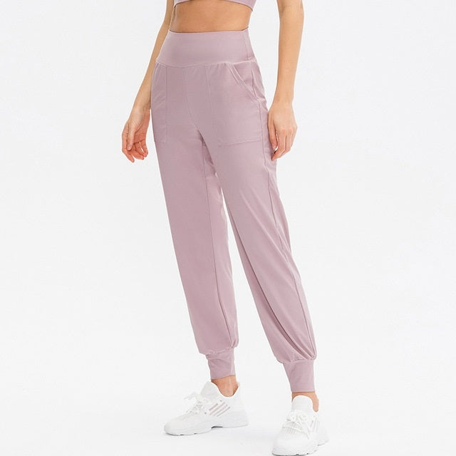 Women's loose sports trousers, dusty pink, elastic waist with tapered ankle cuffs