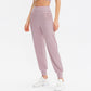 Women's loose sports trousers, dusty pink, relaxed tapered legs with cuffed ankle hem