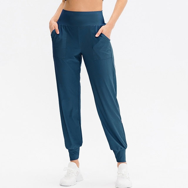 Women's loose sports trousers, deep blue jogger with elastic waist and ankle cuffs