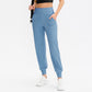 Women's loose sports trousers, light blue jogger with elastic waist and ankle cuffs