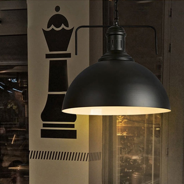 Black single-head pendant light with dome shade and warm underglow