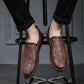 Dark brown leather slip-on shoes with round toe and side elastic panels