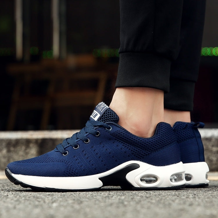 Men's blue mesh running shoe on foot with white sole and air-cushion detail