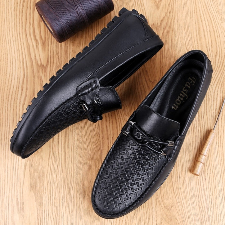 Men's black round-toe leather loafers with decorative lacing and embossed side texture