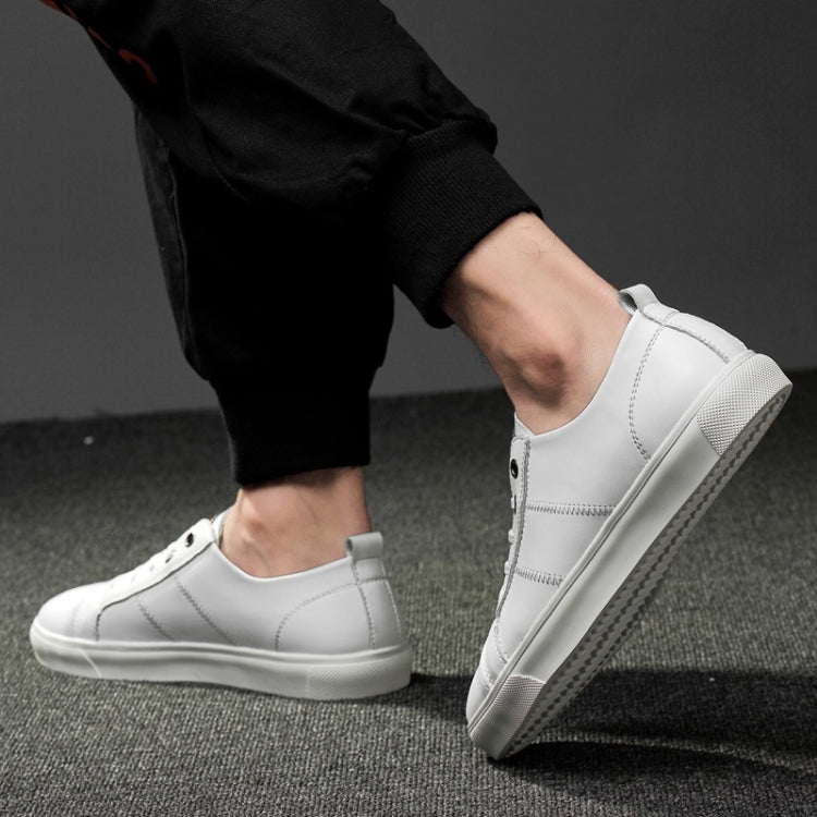 Men's white lace-up sneakers in profile view with low profile rubber sole