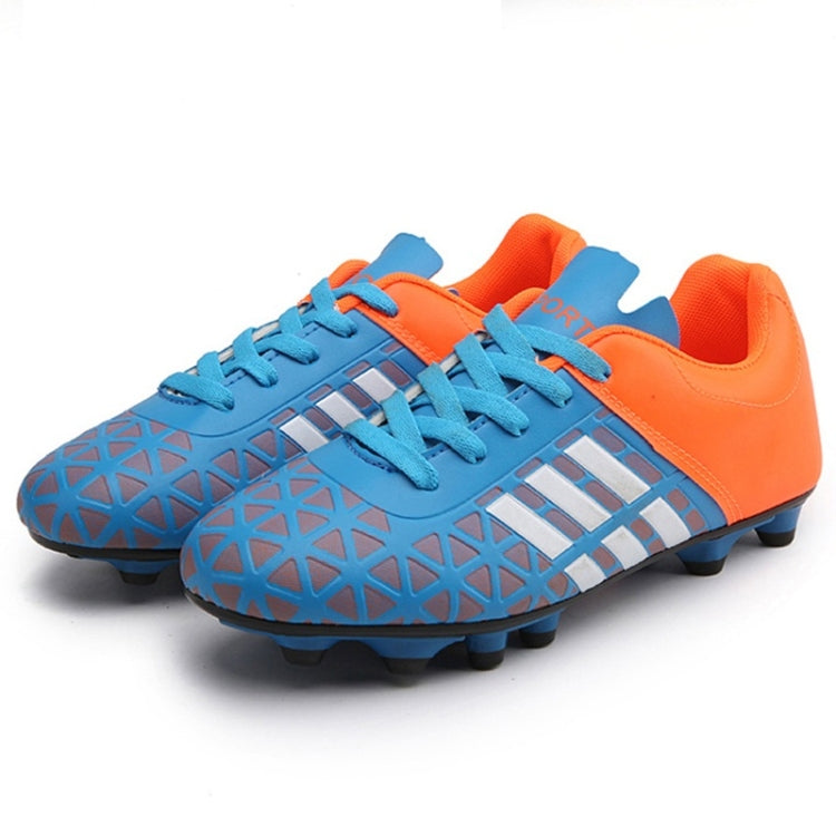 Blue and orange soccer shoes with black laces, white stripe accents, and studs
