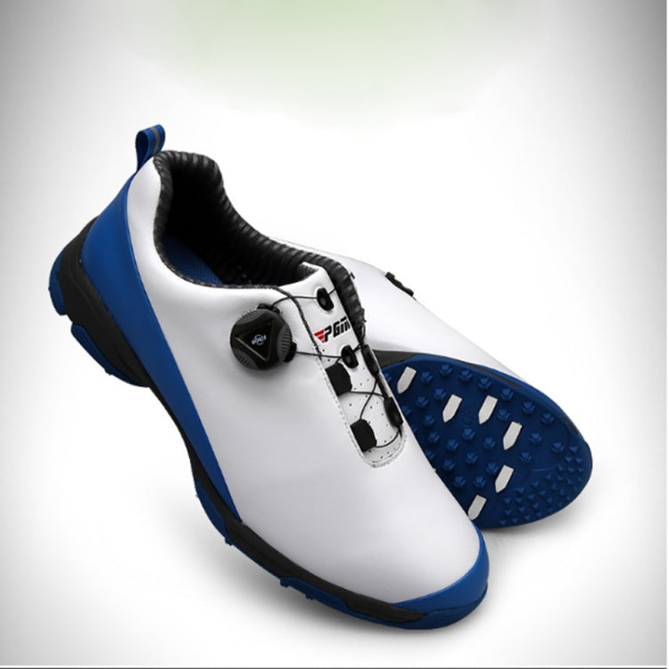 Waterproof golf shoe, white upper with blue trim and cleated traction outsole