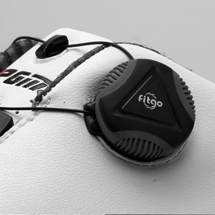Rotary buckle on waterproof golf shoe upper, black dial on white textured material