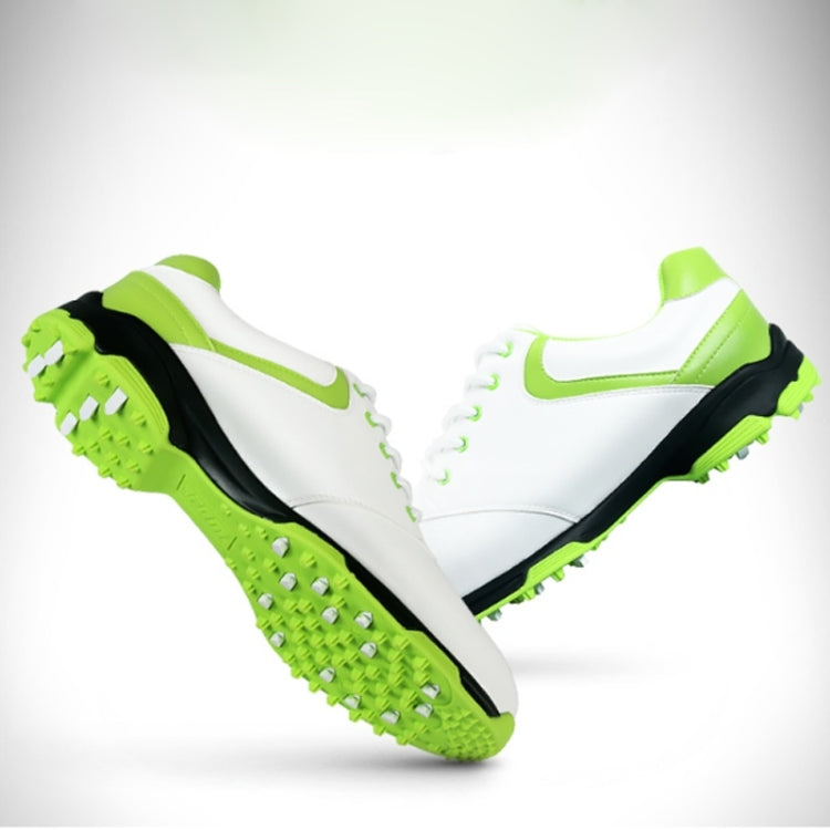Pair of white golf sneakers with neon green lining, swoosh, and cleated traction soles