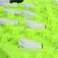 Neon green traction outsole with molded cleats for grip