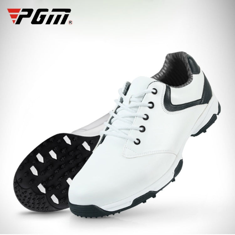 Men's white golf sneakers with black collar and black studded outsole