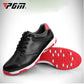 Men's black leather-style golf shoes with red traction outsole and black laces
