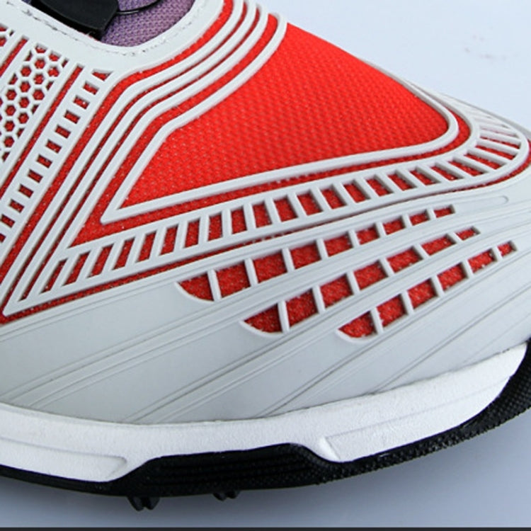 Golf sneaker upper close-up in red with white textured lines and perforations