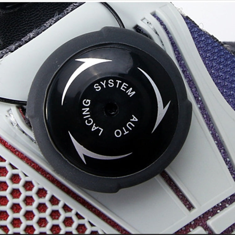 Dial buckle detail on golf sneaker with black circular SYSTEM label and lacing