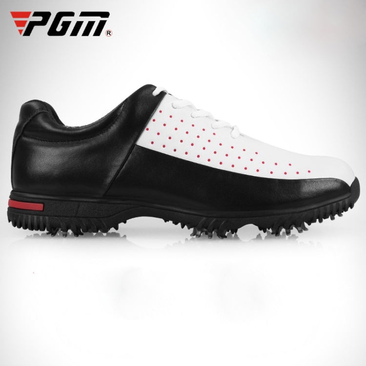 Men's golf sneakers, black and white with red dot accents and cleated rubber sole