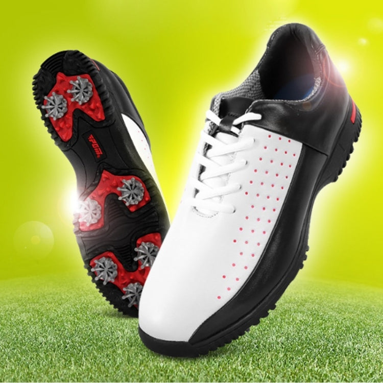 Men's golf sneakers, black and white with cleats on textured sole and red dot panel