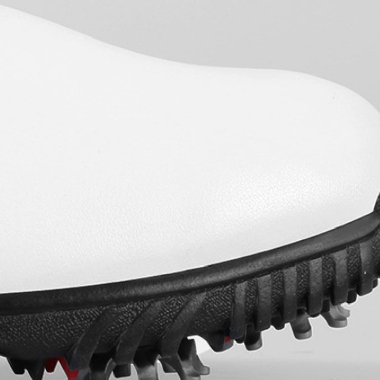 Golf sneaker outsole side view with raised tread and short traction cleats