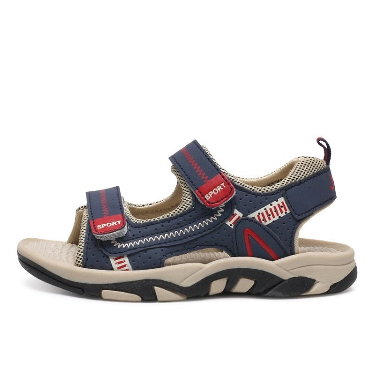 Kids navy sport sandals with two straps, perforated panels, and chunky beige sole