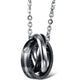 Black interlocking ring pendant necklace with clear crystal accents and silver chain