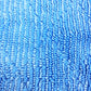 Blue microfiber cleaning pad texture close-up